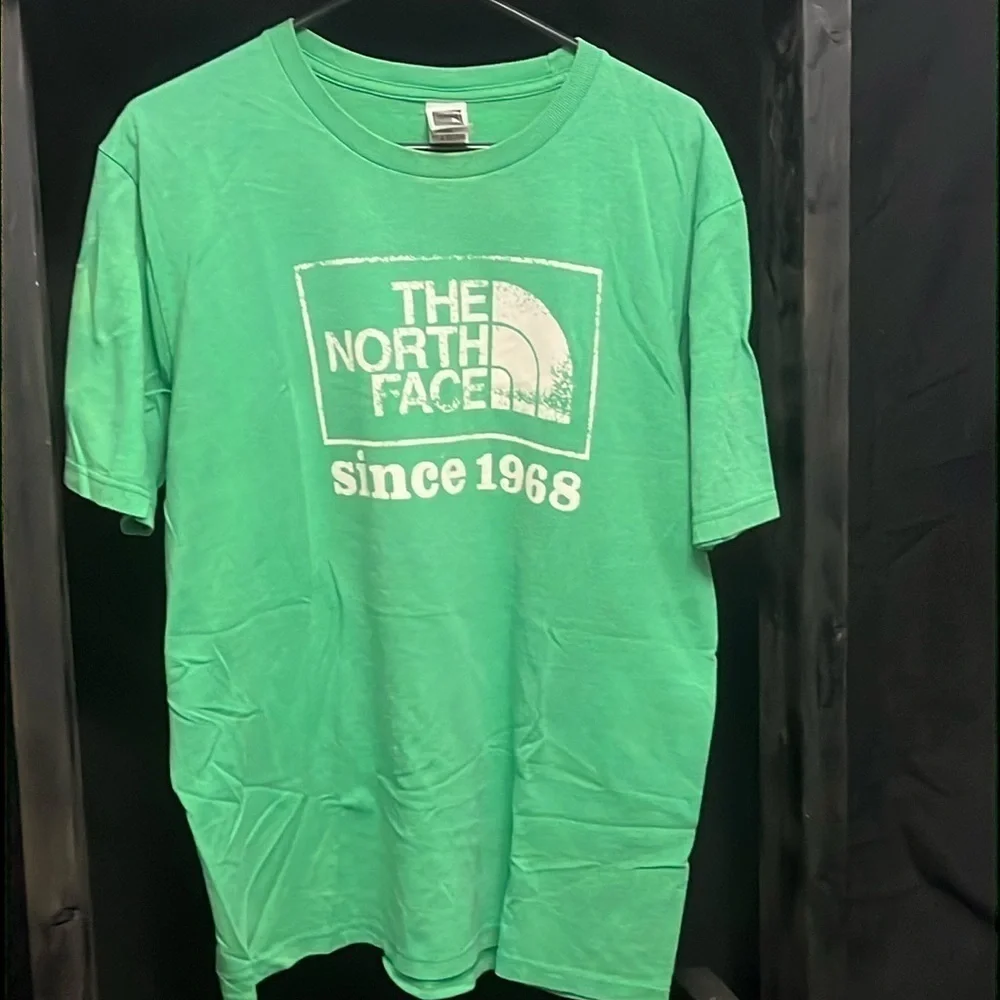 The North Face- green shirt with cream logo on front